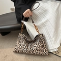Fashionable leopard print envelope bag featuring amber acrylic chain and leather strap - Brown