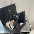 Chic black shoulder bag with gold bow detail and minimalist retro leather design - Black