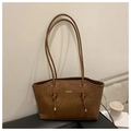 Detail of dark brown tote bag with FASHION text, knotted strap and gold hardware accents - No Pendant / Brown