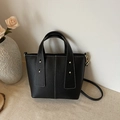 Black lychee-patterned tote bag with white contrast stitching and gold rivets detail - Black
