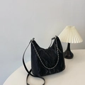 Black velvet crossbody bag with silver chain detail on a minimalist white table - Black Without Pendant