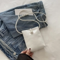 Mini white crossbody phone bag featuring a large decorative pearl magnetic closure - White