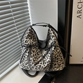 Black and white leopard print underarm bag with bow detail and multiple straps - White