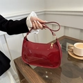 Chic dark red glossy patent leather baguette hobo bag with sleek minimalist shoulder strap - Red