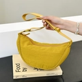 Minimalist ginger yellow crescent nylon crossbody bag with adjustable strap in casual style - Yellow