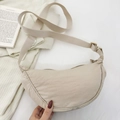 Beige crescent nylon crossbody bag with adjustable wide strap for casual daily use - Off White