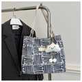 Detailed close-up of blue canvas tote bag featuring geometric patterns and cloud charm - Blue With Cloud Pendant