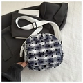 Detail of blue plaid mini crossbody bag with black heart print and wide textile strap - Blue