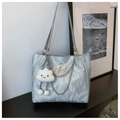 Detail of silver tote bag with metallic crinkle texture, chain accents and butterfly charm - Silver (With Cloud Pendant)