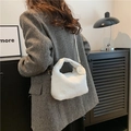 Chic white faux fur handbag for women with adjustable shoulder strap and decorative tag - White