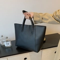 Minimalist black large capacity tote bag with dual handles and vertical stitching design - Black