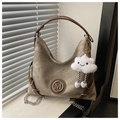 Detail of khaki canvas hobo bag with M logo, leather strap and plush cloud charm - With Pendant / Khaki