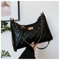 Detail of black quilted leather shoulder bag with gold metal twist lock and chain strap - Large / Black