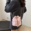 Pink denim drawstring bucket bag with frayed quilted texture and pearl accents - Pink