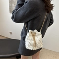 White washed denim bucket bag with frayed quilted texture and pearl drawstring details - Beige
