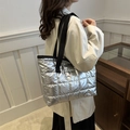 Chic silver quilted tote bag with metallic glossy finish and black shoulder straps - Silver