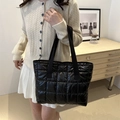 Minimalist black puffer quilted tote bag with padded nylon texture and shoulder straps - Black