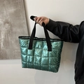 Chic mint green quilted tote bag with metallic finish and black webbing handles - Green