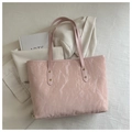 Detailed close-up of pink tote bag with glossy pleated texture and gold rivet hardware - No Pendant / Pink