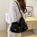 Black hobo shoulder bag with silver butterfly charms and pleated faux leather texture - No Pendant / Black