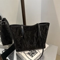 Large black pleated tote bag for women with modern textured finish and slim shoulder straps - Black