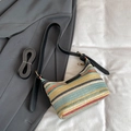 Rainbow striped woven shoulder bag with black leather straps and fashion label - Black