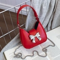 Mini red crossbody bag with silver bow accent and metallic chain strap for women - Mini Red