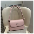 Pink PU leather shoulder bag featuring a silver bow accent and knotted handle detail - Pink