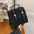 Black vintage backpack with pleated texture and silver buckles in a stylish urban setting - No Pendant / Black