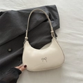 Off-white crescent underarm bag with a silver bow detail on a grey blazer - White
