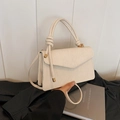 Creamy white pleated crossbody bag with knoted handle and gold hardware detail - White
