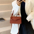 Caramel brown pleated crossbody bag with knot handle and gold hardware detail - Brown