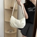 Chic white pleated crescent bag in PU leather featuring a stylish shoulder strap - White