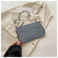 Detail of grey-blue suede handbag with silver bead trim and metal chain strap - Blue