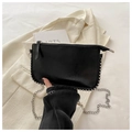 Detail of glossy black envelope bag featuring silver bead rivets and metal chain strap - Black