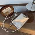 Metallic silver mini crossbody phone bag with braided strap and spherical knot detail - Silver