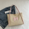 Large beige straw tote bag with pink leather bow decoration and slim handles - Pink