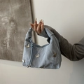 Hellblaue Schleifen-Handtasche mit silbernen Schmetterlingen und Knotengriff - Blau