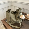 Olive green drawstring nylon tote bag with wide strap and cupcake plush charm - With Pendant / Green