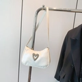 White glossy baguette shoulder bag featuring a silver rhinestone heart buckle detail - White