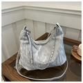 Close-up of metallic silver tote bag with chain detail on a minimalist coffee table - No Pendant / Silver