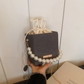 Gray bucket bag with pearl handle, drawstring lining, and gold chain strap detail - Black