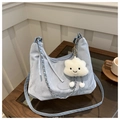 Detailed close-up of light blue pleated hobo bag with silver chain and white cloud charm - With Pendant / Blue