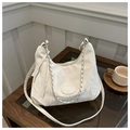 Detail of white pleated shoulder bag with silver chain strap on a wooden table - No Pendant / White