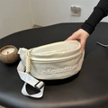 Creamy white canvas waist bag with embroidered letters and adjustable wide fabric strap - Beige