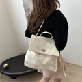 Chic off-white pleated leather crossbody bag with silver oval clasp and slim shoulder strap - White