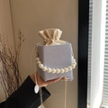 Light blue textured bucket bag with decorative pearl handle and gold chain strap - Blue