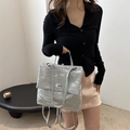 Silver wrinkled fabric backpack featuring a metallic oval twist lock and minimalist design - Silver