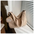 Close-up of beige corduroy texture on dumpling bag with mini round pouch detail - Khaki With Mini Bag