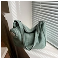 Detailed texture of green corduroy dumpling bag with a matching round coin purse pouch - Light Green With Small Pouch